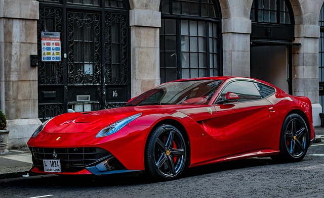 a red car parked next to the sidewalk