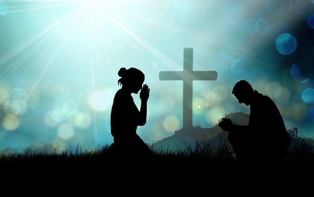 this is a picture of a person praying to the cross