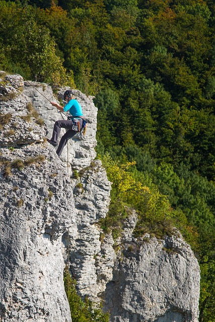 man climbing a mountain