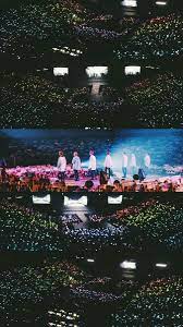 photo of bts at a concert in front of a crowd
