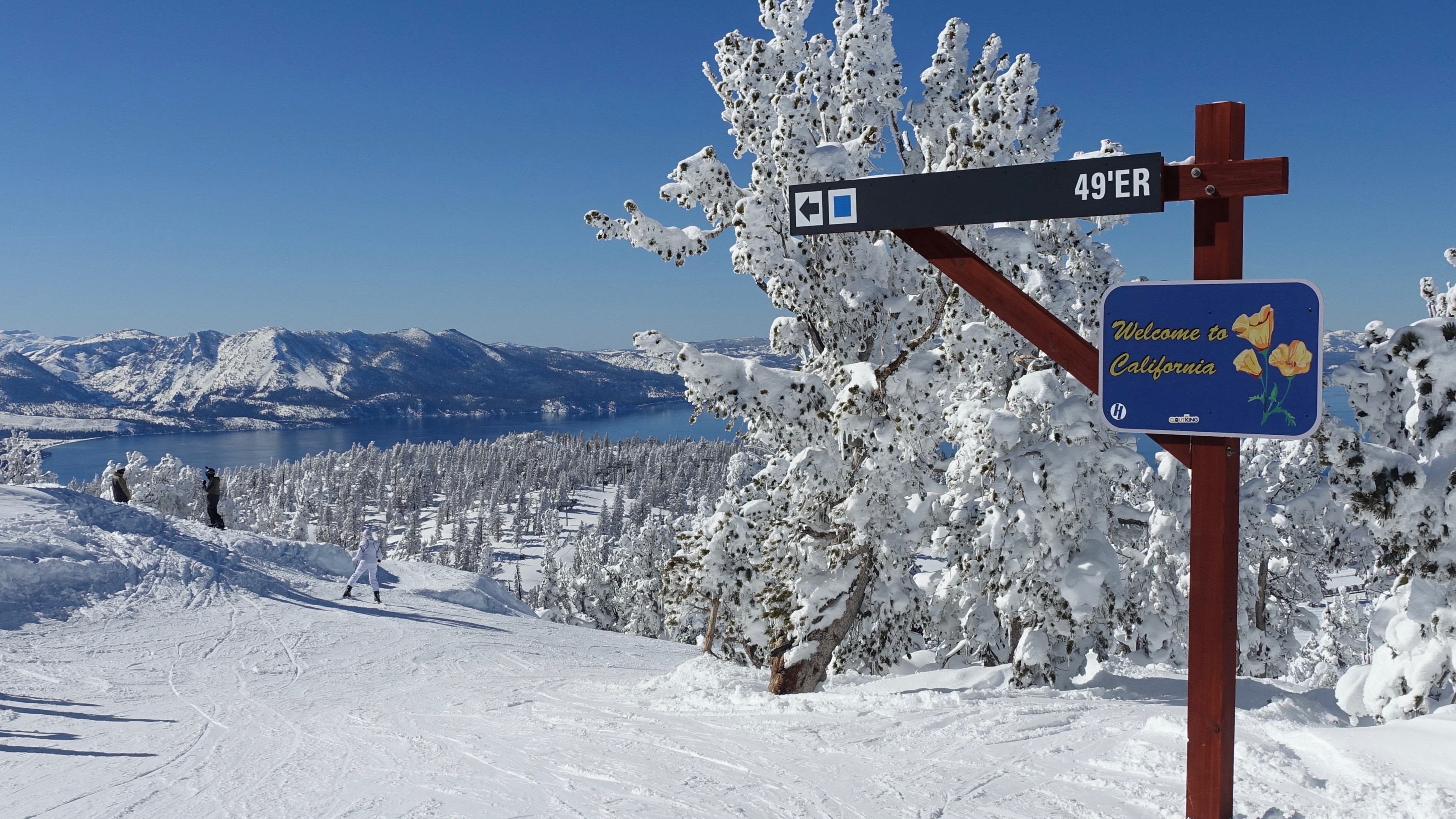 Welcome to California sign surrounded by snow