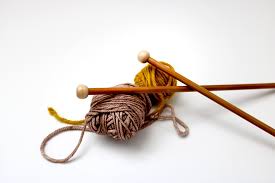straight needles and yarn
