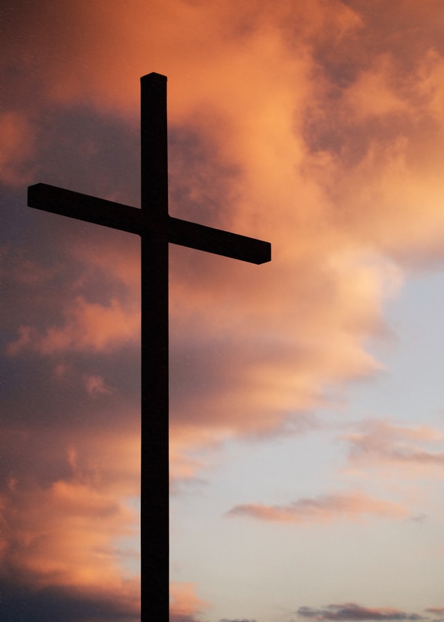 cross under a sunset photo