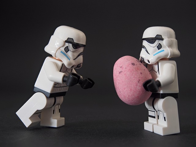 lego stormtrooper handing a chocolate egg to another stormtrooper