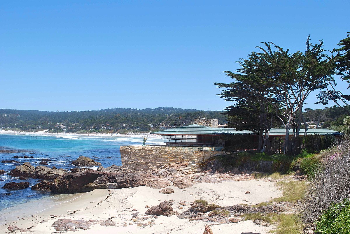 View of Carmel Beach and sidelining trees along with and balcony-like structure