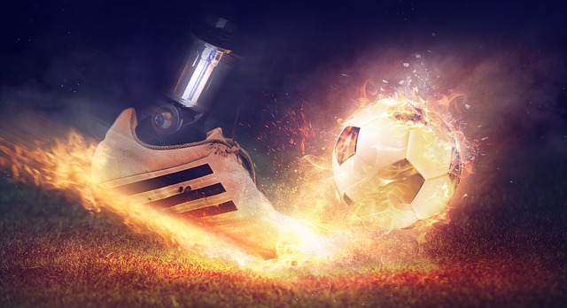 Soccer cleat on fire kicking soccer ball