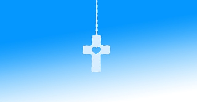 a white cross with a heart in the middle with a blue backround
