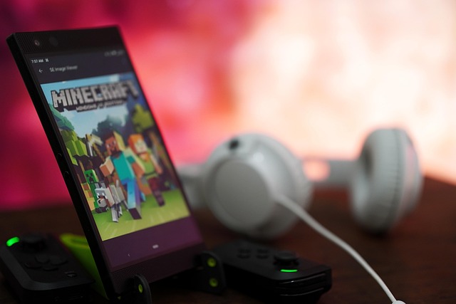 A  phone that image that has the cover of the mincaft with headphone next to it