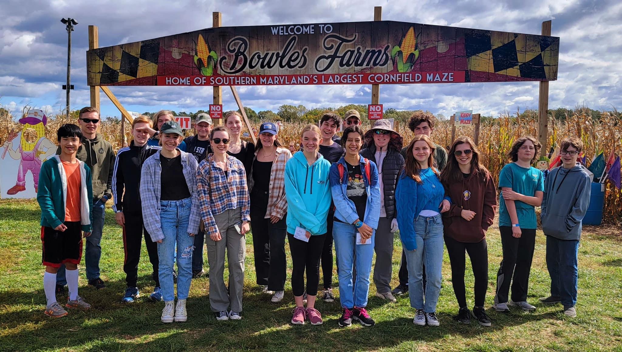 A group of students standing in front of bowles farms