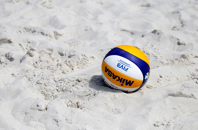 a picture of a vollyball on the beach in the sand