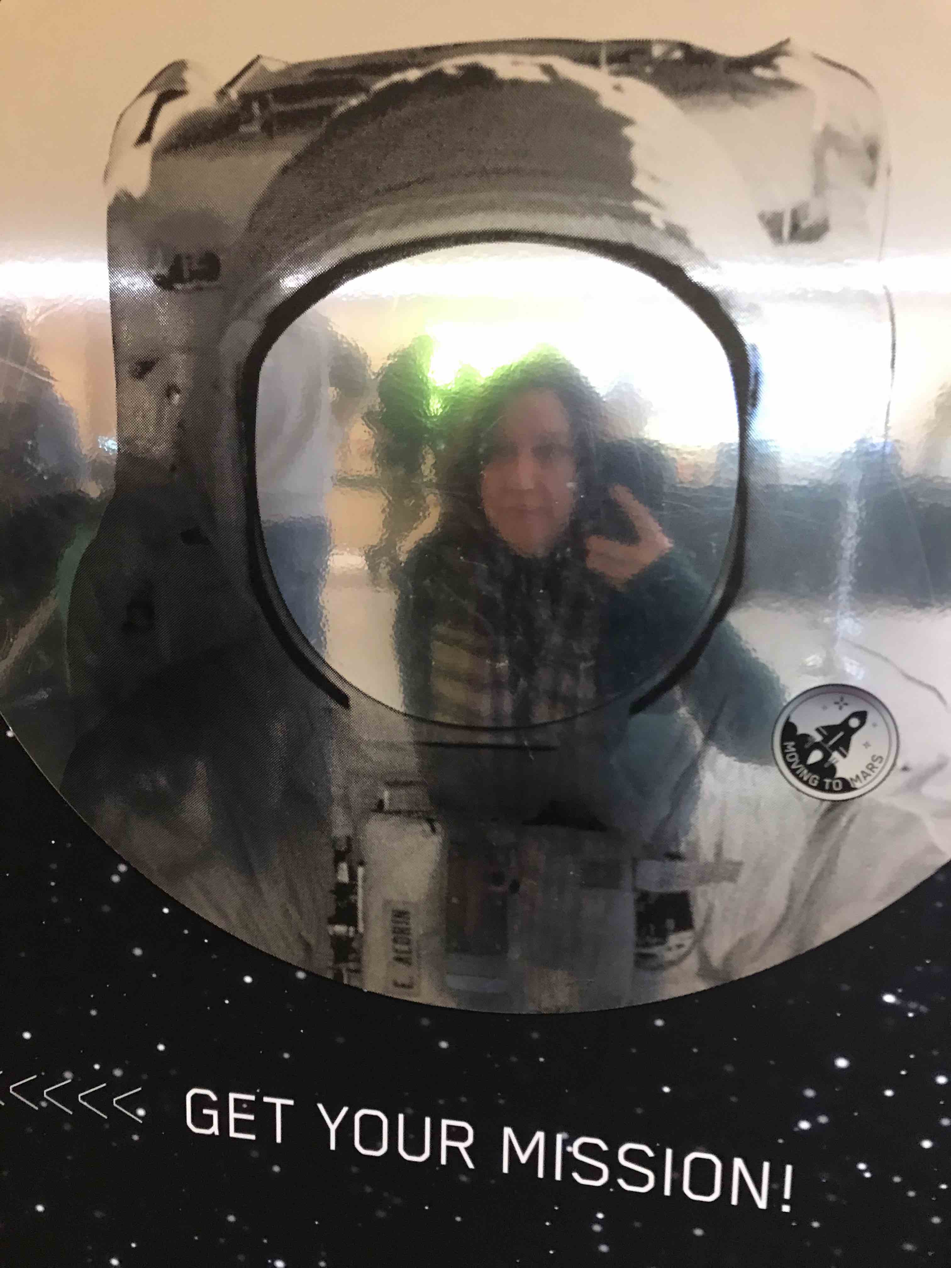 astronaut selfie mirror at Design museum, with woman taking photo