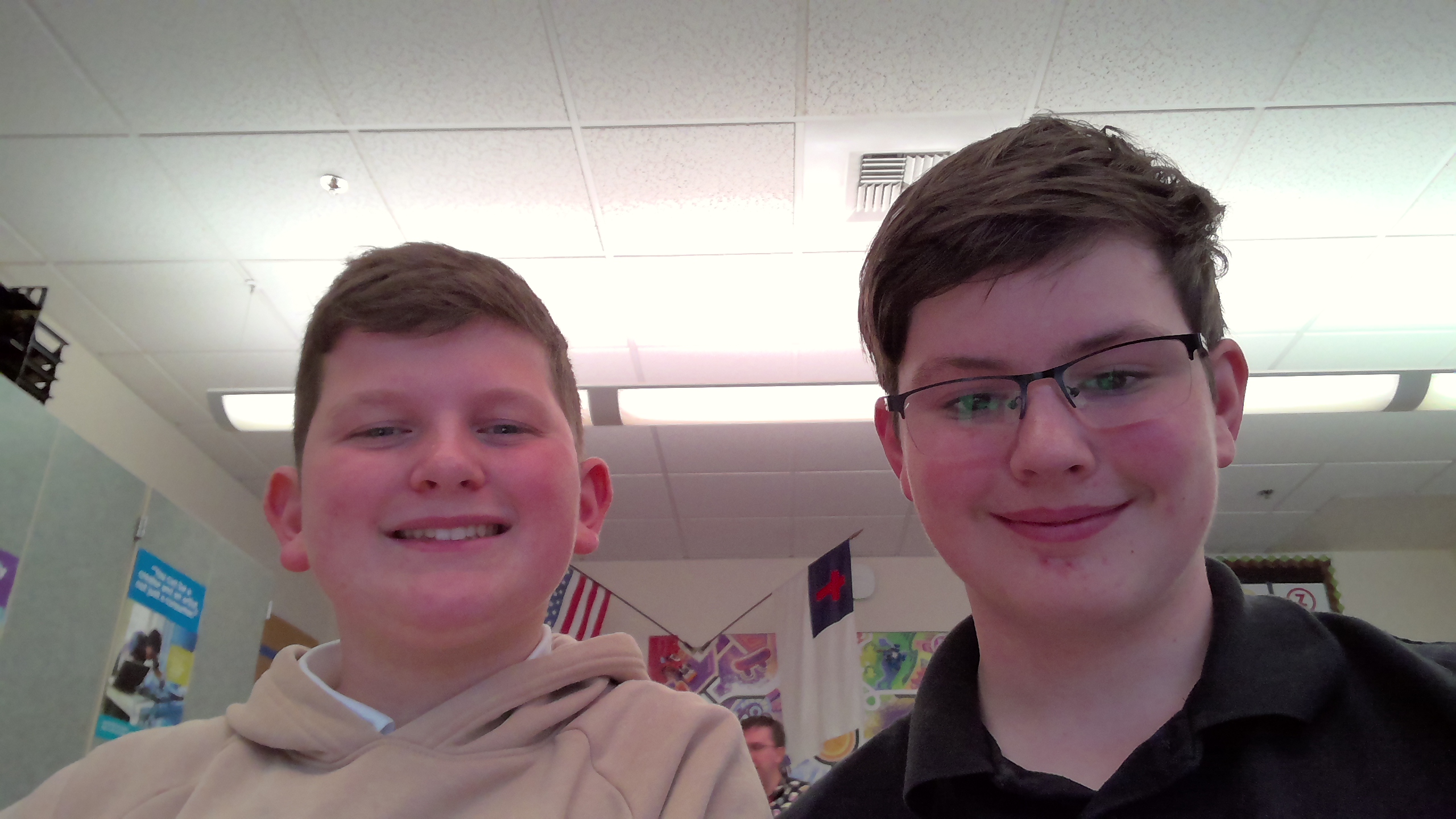  two men standing next to each other