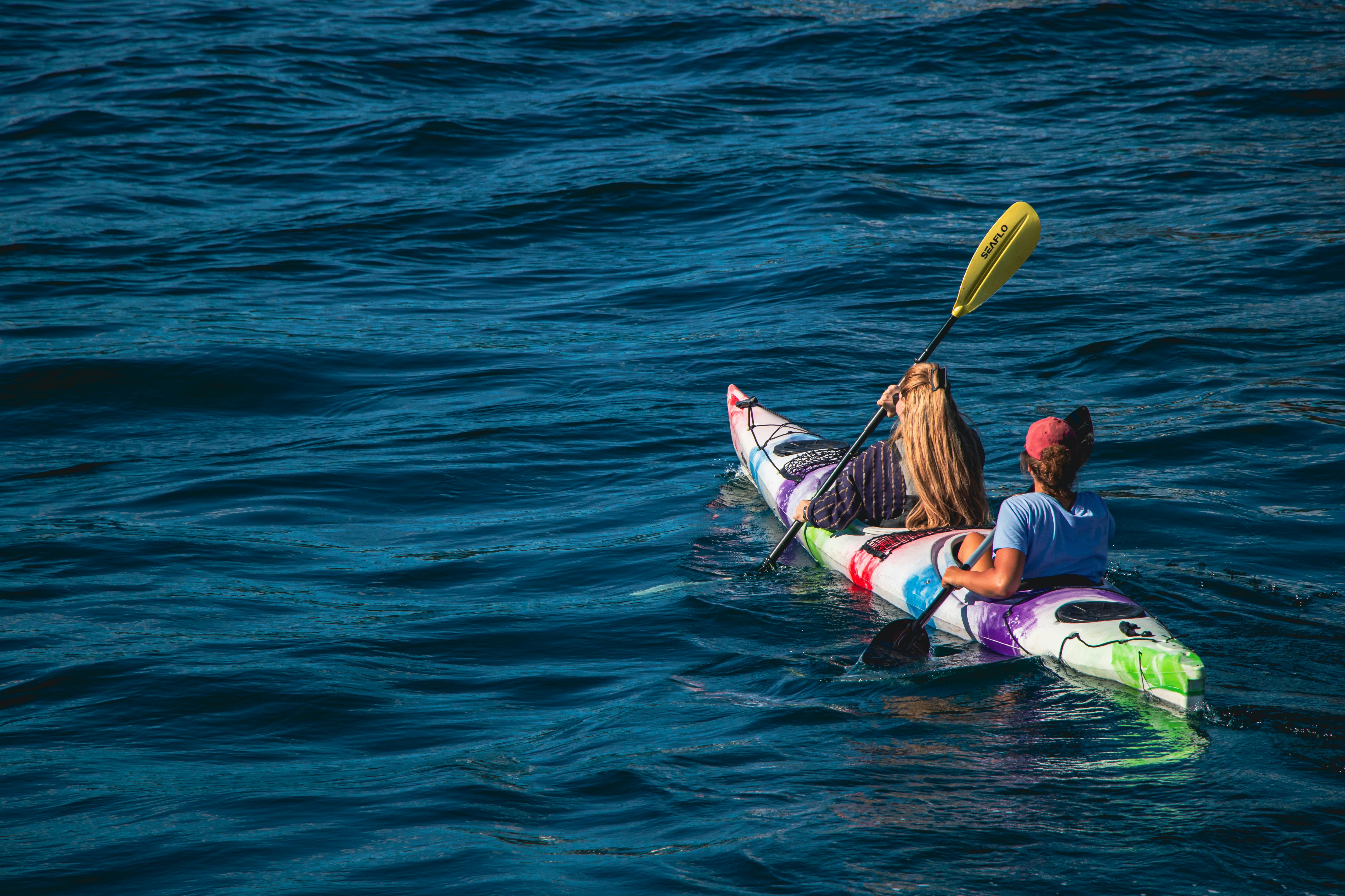  two people in a kayak on the water