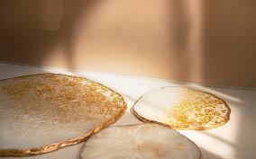 gold-lined sparkling curcle shaped drink coasters