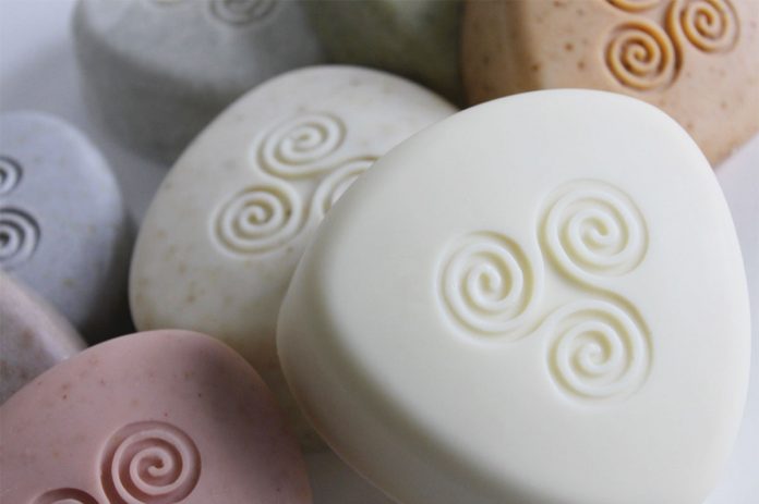 softly colored red, orange, and yellow, circle shaped soap bars