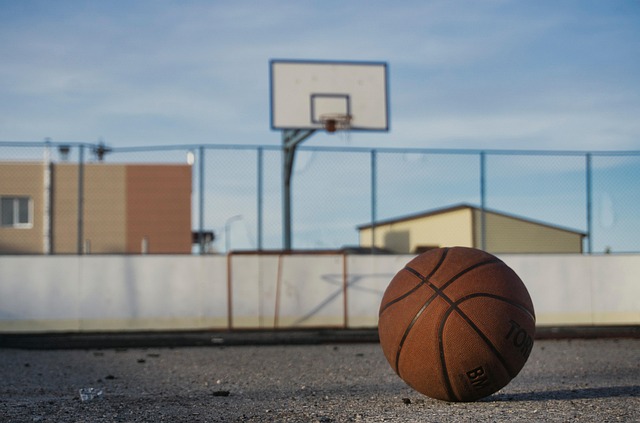 A basketball on a desolate court.