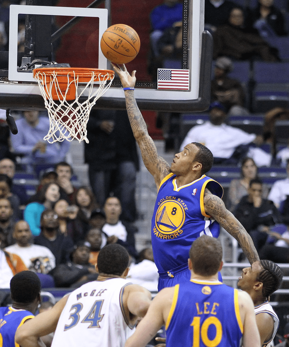 Picture of a Golden State Warrior basketball player making a layup shot