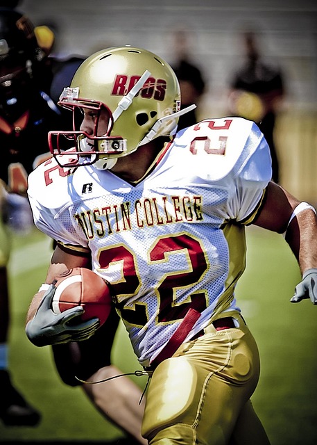 A college football player running with the football