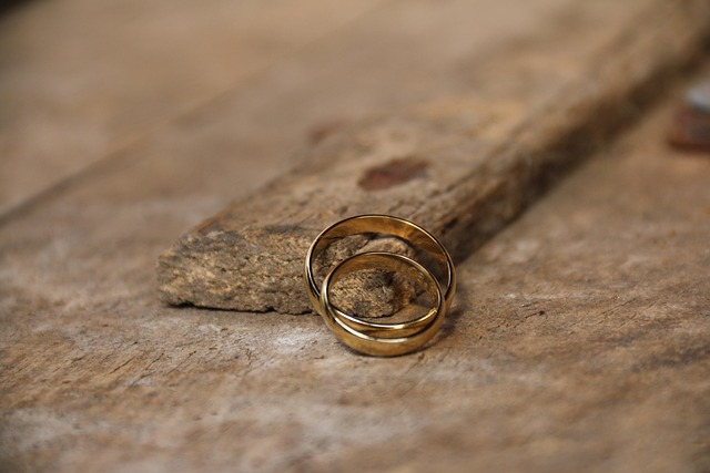 Wedding rings on wood block