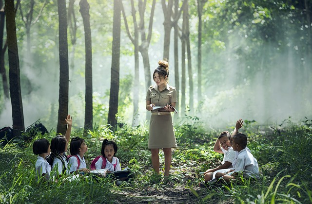 teacher teaching in the woods